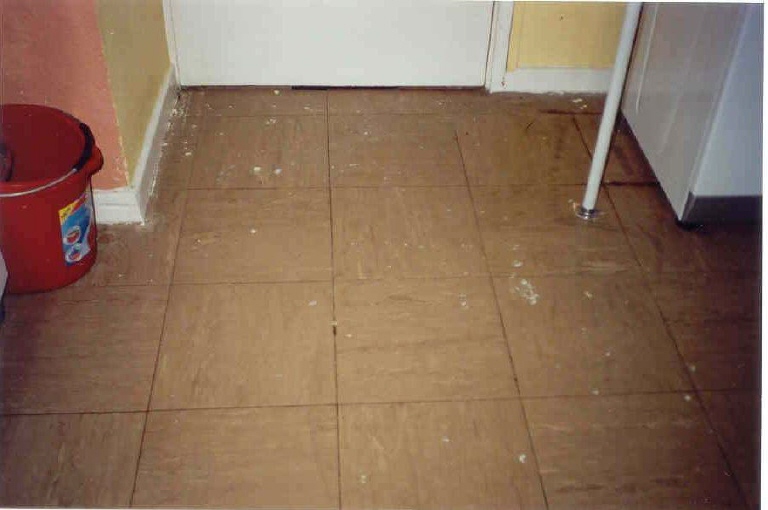 Tiled floor with paint stains